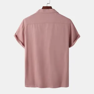 Back view detail of a men's dusty rose short-sleeved casual shirt hanging on a wooden hanger