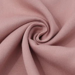 Close-up of soft pink twill fabric texture for men's casual short-sleeve shirt
