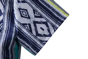 Close-up of ethnic geometric print and stitching on a men's short-sleeve Hawaiian shirt
