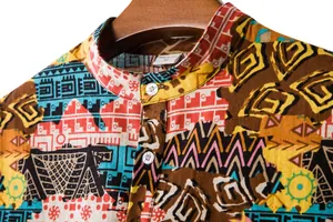 Detailed close-up of a men's short sleeve shirt with vibrant ethnic geometric print