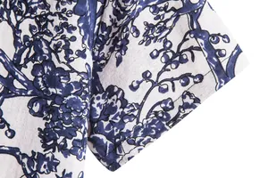 Macro detail of blue floral print on men's vintage Hawaiian short-sleeve shirt fabric