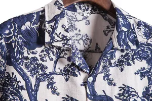 Close-up detail of vintage Hawaiian blue floral print shirt with collar and button