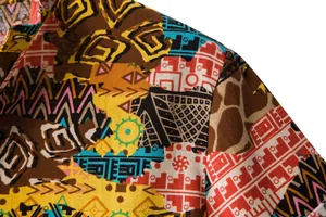 Close-up detail of the vintage ethnic pattern and linen texture on this men's shirt.