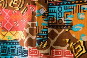 Close-up of vibrant tribal geometric pattern on breathable linen-textured men shirt
