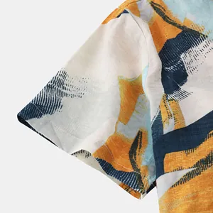 Close-up detail of a Hawaiian style men's shirt sleeve with abstract colorful prints.