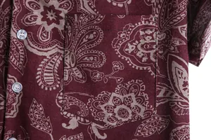 Detailed close-up showing the pocket and burgundy paisley pattern of a casual shirt