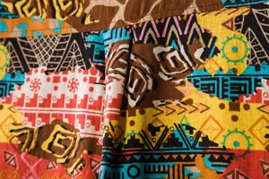 Macro view of vibrant ethnic tribal geometric print fabric on men's short sleeve shirt