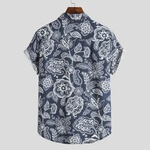 Detailed back view of a blue men's short sleeve shirt featuring white paisley floral prints.