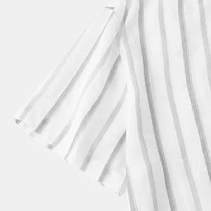 Detail shot of vertical striped pattern on lightweight summer beach shirt fabric