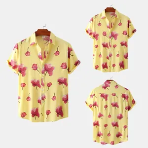 Front and back views of a yellow men's floral shirt with pink flower prints