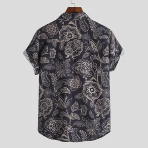 Back view of men's vintage paisley print short-sleeve shirt in navy and beige tones