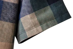 Detailed macro view of sleeve hem on men's breathable plaid linen-cotton casual shirt