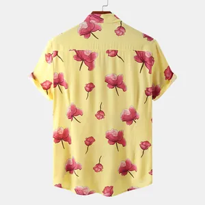 Detailed back view of a men's vibrant yellow short-sleeve shirt with pink flowers
