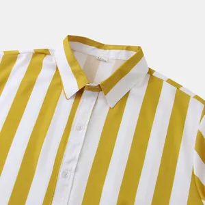 Dettaglio del colletto di una camicia hawaiana da uomo a righe gialle