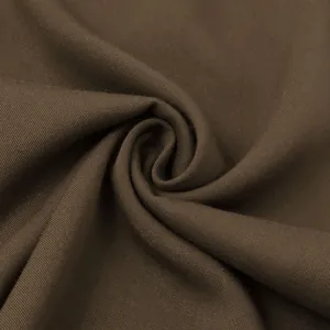 Close-up macro shot of dark brown cotton twill fabric showing detailed texture and weave
