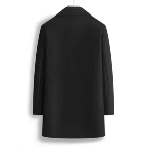 Detailed back view of a premium men's black mid-length slim fit wool overcoat hanging.
