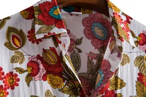 Macro view showing the collar and vibrant floral print of a men's casual short sleeve shirt