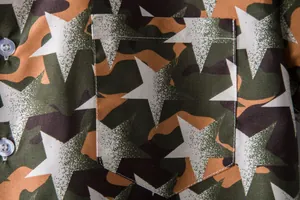 Close-up of men's Hawaii shirt featuring camouflage star print and chest pocket