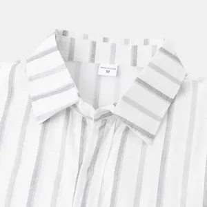 Detail shot of a white and grey vertical striped men's casual shirt collar area.
