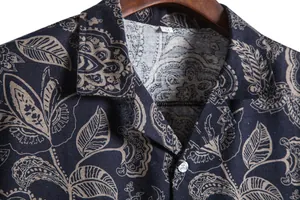Close-up of men's vintage Hawaiian style shirt with floral leaf print and collar detail