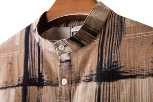Detailed close-up of a men's linen-blend casual shirt with abstract black striped print