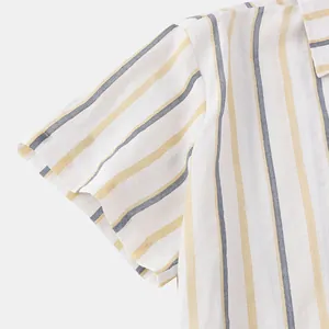 Close-up detail of breathable linen-like fabric with blue and yellow vertical stripes