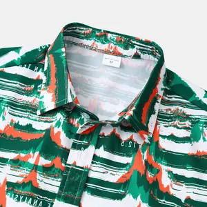 Détail d'une chemise hawaïenne pour hommes avec imprimé abstrait vert et orange sur le col