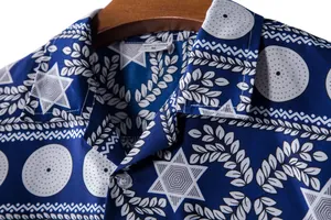 Close-up detail of men's ethnic print Hawaiian short sleeve shirt with star patterns