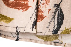 Macro detail of breathable fabric texture and leaf pattern on retro men's shirt