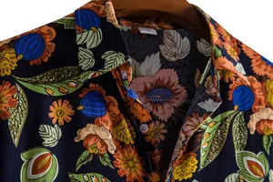 Close-up view showing the vibrant botanical floral print and collar detail of a men's casual shirt.