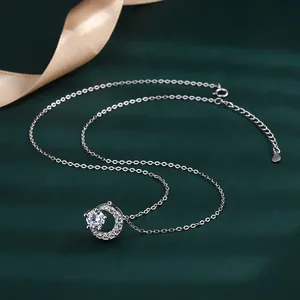 Elegant S925 silver round pendant necklace with large central diamond on green background