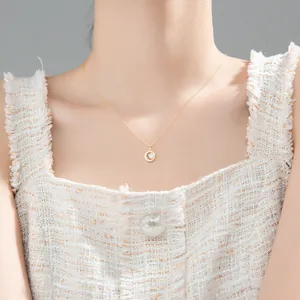 Elegant gold chain necklace with a sparkling circular diamond pendant for women.