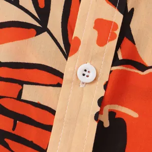 Detailed close-up showing the vibrant floral print and white button on a men's summer shirt