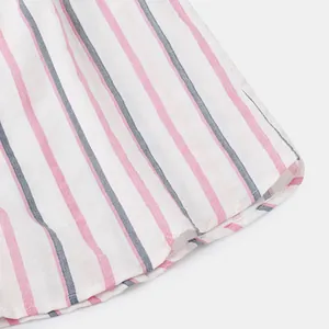 Close-up macro detail of the striped pink and blue fabric texture of a men's beach shirt