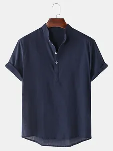 Detail view of a men's navy blue cotton linen short sleeve shirt with stand collar.