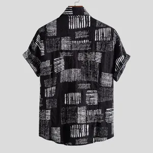 Back view of a men's short-sleeved casual shirt with abstract white geometric prints.