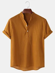 Macro view of mustard yellow men's linen short sleeve shirt featuring a mandarin collar