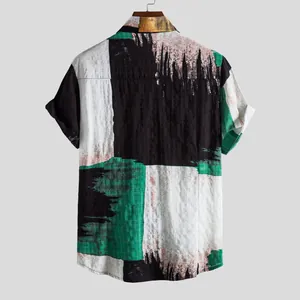 Back view of a men's casual short-sleeve shirt with abstract block-print pattern