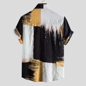 Detailed back view of a men's short-sleeve shirt with bold abstract color-block print