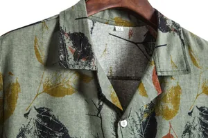 Close-up of vintage leaf print linen shirt with button-down collar and size tag