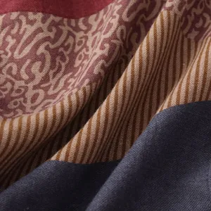 Macro detail shot of men's ethnic casual shirt fabric with multi-pattern patchwork