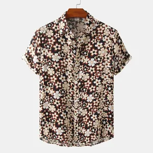 Detailed view of a vintage men's short-sleeved floral button-up shirt with brown print