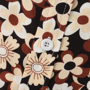 Detailed close-up of men's floral shirt showing vintage print and white button texture