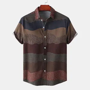 Detail view of a men's ethnic style short sleeve shirt with wave patterns and stripes