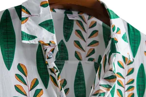 Detail shot of men's summer short-sleeved casual shirt with green leaf pattern