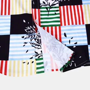 Gros plan d'une chemise hawaïenne pour homme avec motif floral patchwork et ourlet.