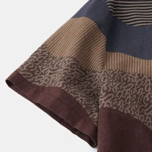 Close-up of ethnic pattern and fabric texture on men's casual short sleeve shirt