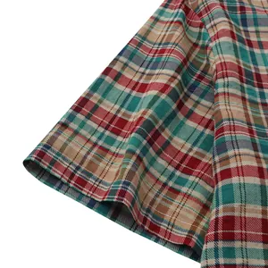 Macro view of short sleeve stitching on colorful plaid casual Hawaiian beach shirt
