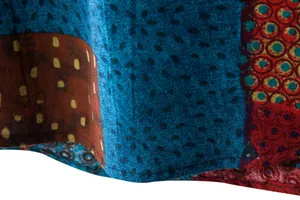 Macro view of ethnic floral pattern and breathable linen texture on casual shirt hem