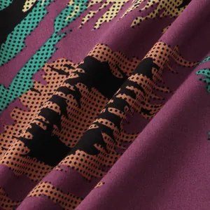 Close-up of purple floral fabric pattern on men's short sleeve summer shirt
